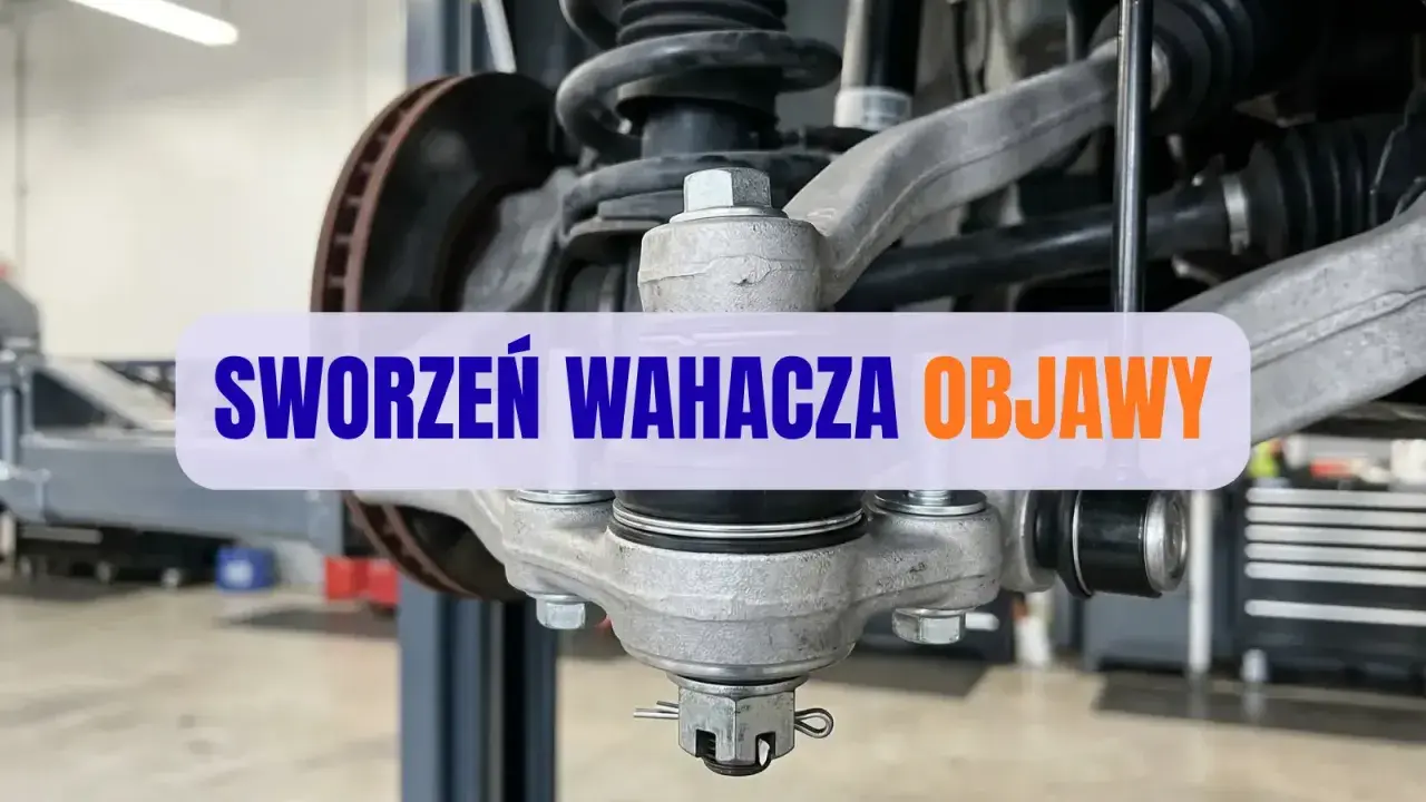 Widok na zawieszenie samochodu z widocznym sworzniem wahacza. Wymiana sworznia wahacza może być konieczna, gdy pojawią się niepokojące objawy.