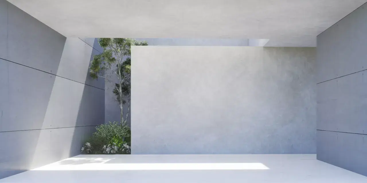 Moderne Architektur mit transluzentem Beton und grüner Vegetation. Sonnenlicht fällt durch eine Öffnung und beleuchtet den Boden.