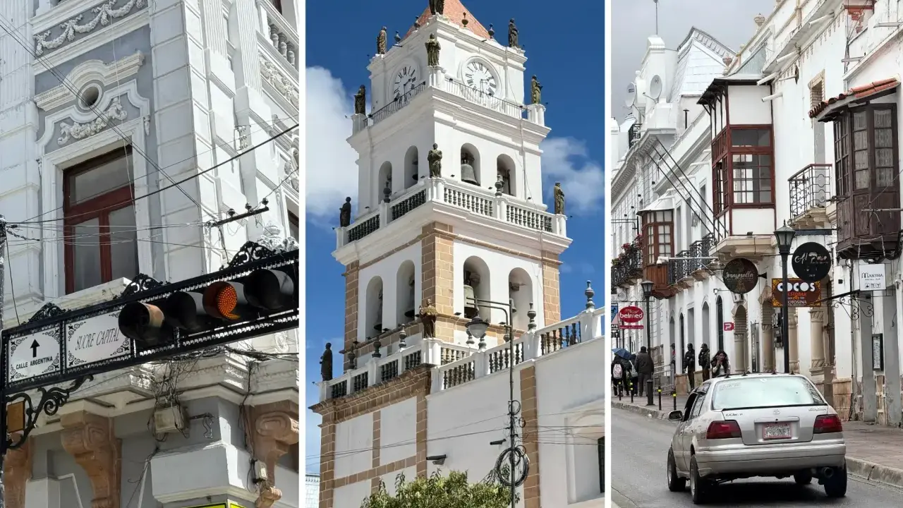 Architektura Sucre: wieża zegarowa, białe budynki z balkonami i uliczka z samochodem.
