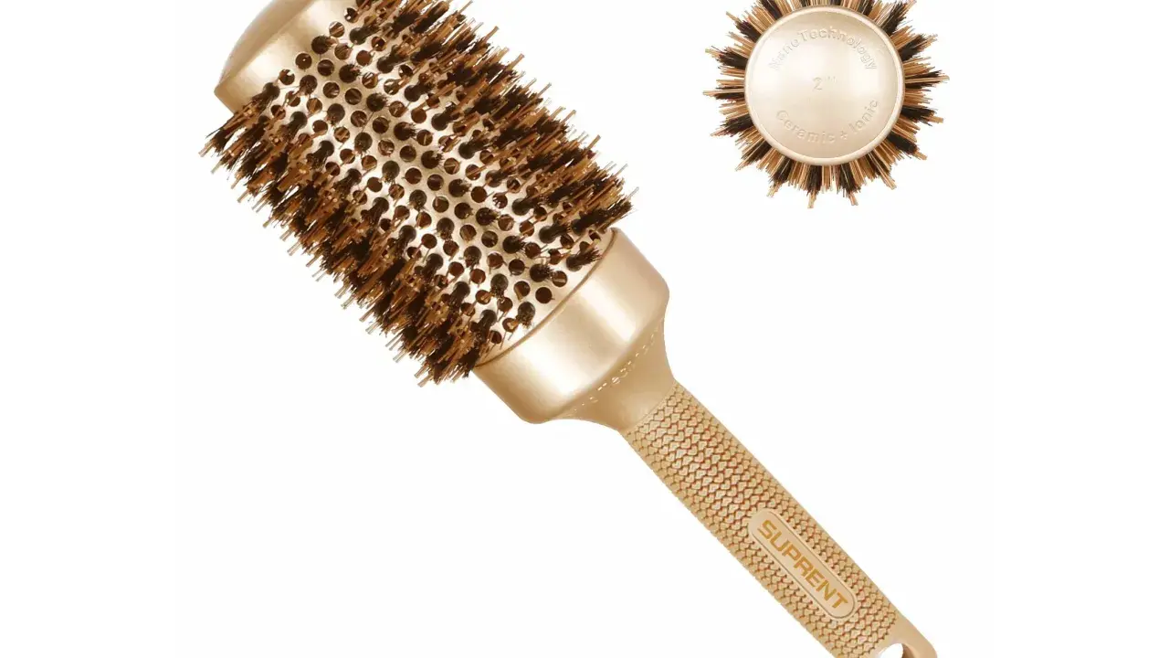 Eine goldene, runde Haarbürste mit Ceramic-Ionic-Technologie und dem Schriftzug "SUPRENT".