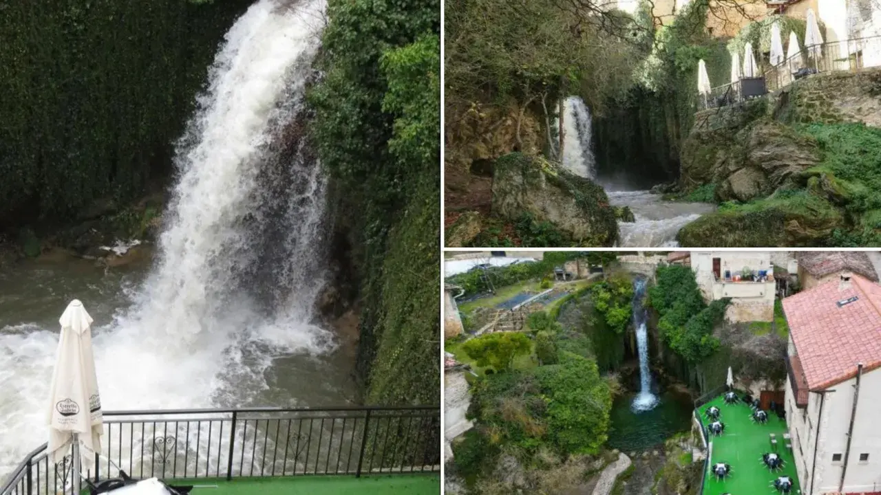 Cascada y terrazas con mesas junto a piscinas naturales en Burgos. Paisaje verde con casas rurales y agua cayendo.