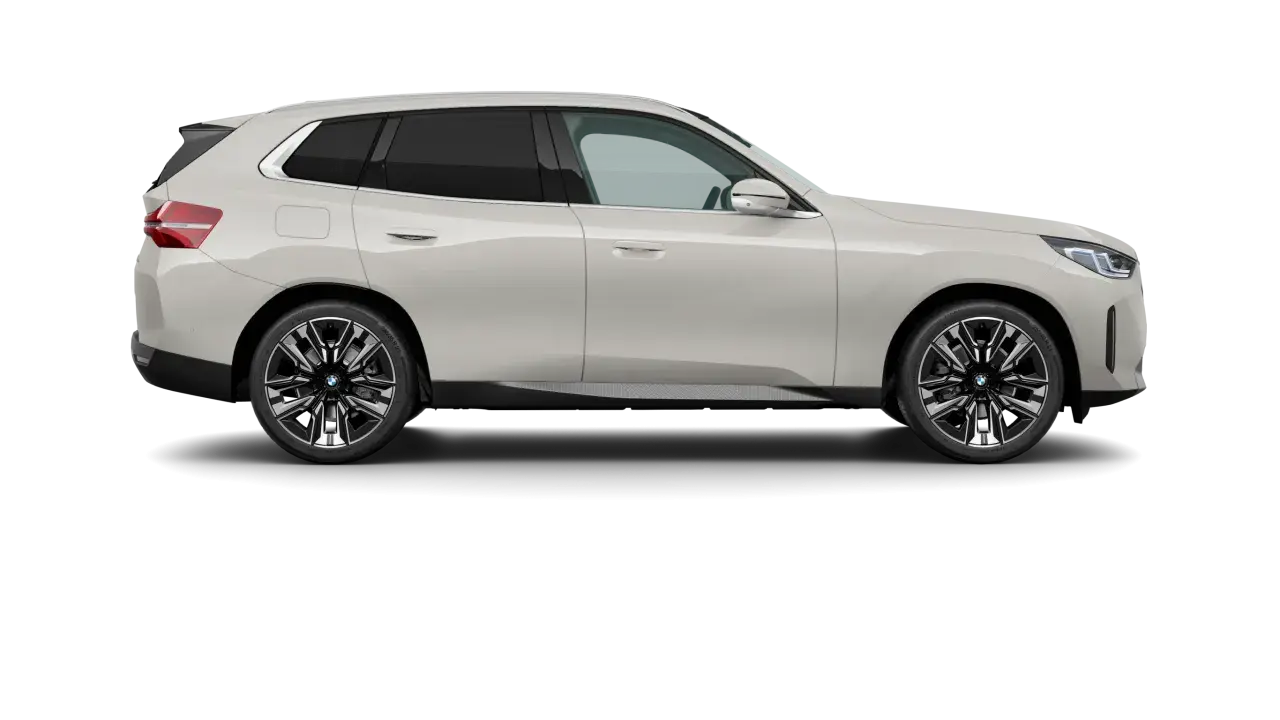 El mejor BMW, un SUV blanco elegante con llantas deportivas, se presenta en un fondo negro, listo para la aventura.