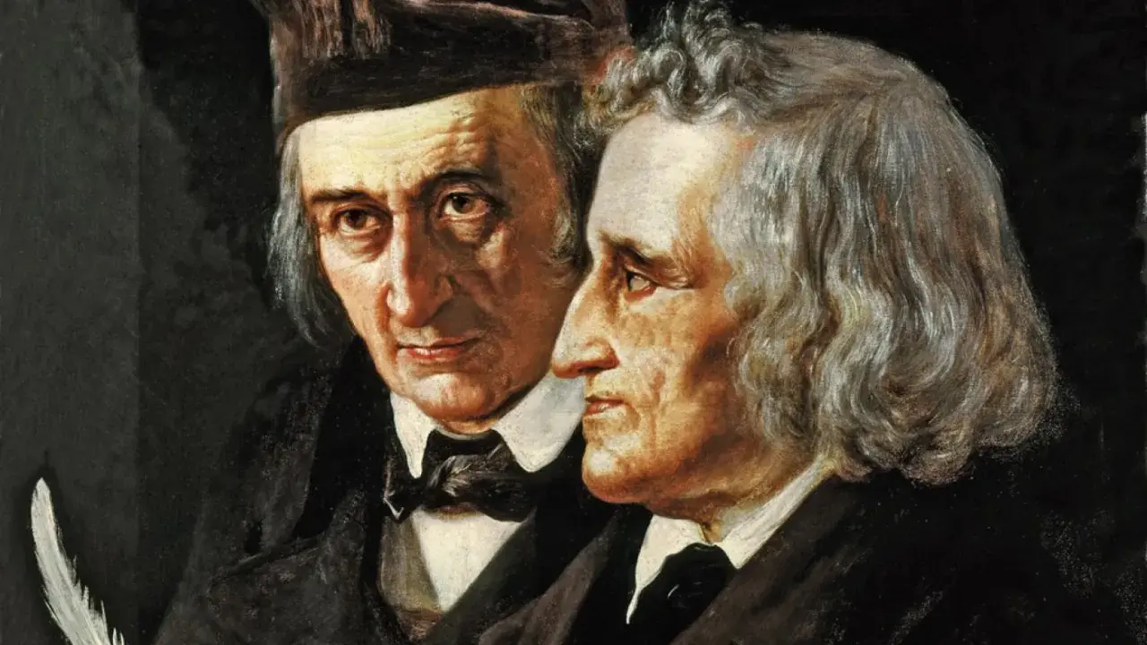 Portret braci Grimm, z piórem w dłoni jednego z nich, gotowych do spisania kolejnej baśni.