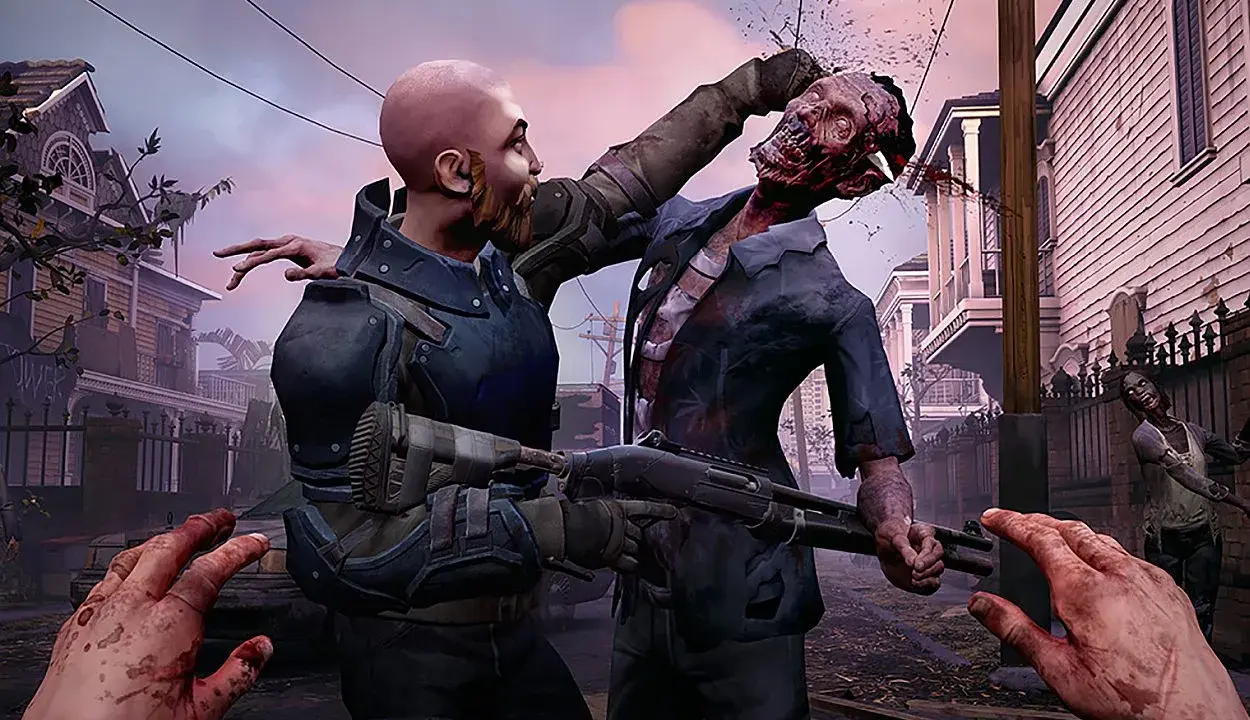 Intensywna scena z gry o zombie: mężczyzna walczy z potworem, strzelając mu w głowę. W tle widać inne zombie i zniszczone domy.