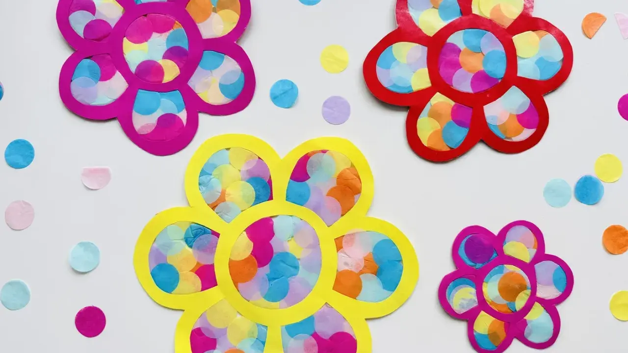 Bunte Blumen aus Papier und Seidenpapier, perfekt zum Fensterdeko basteln mit Kindern.