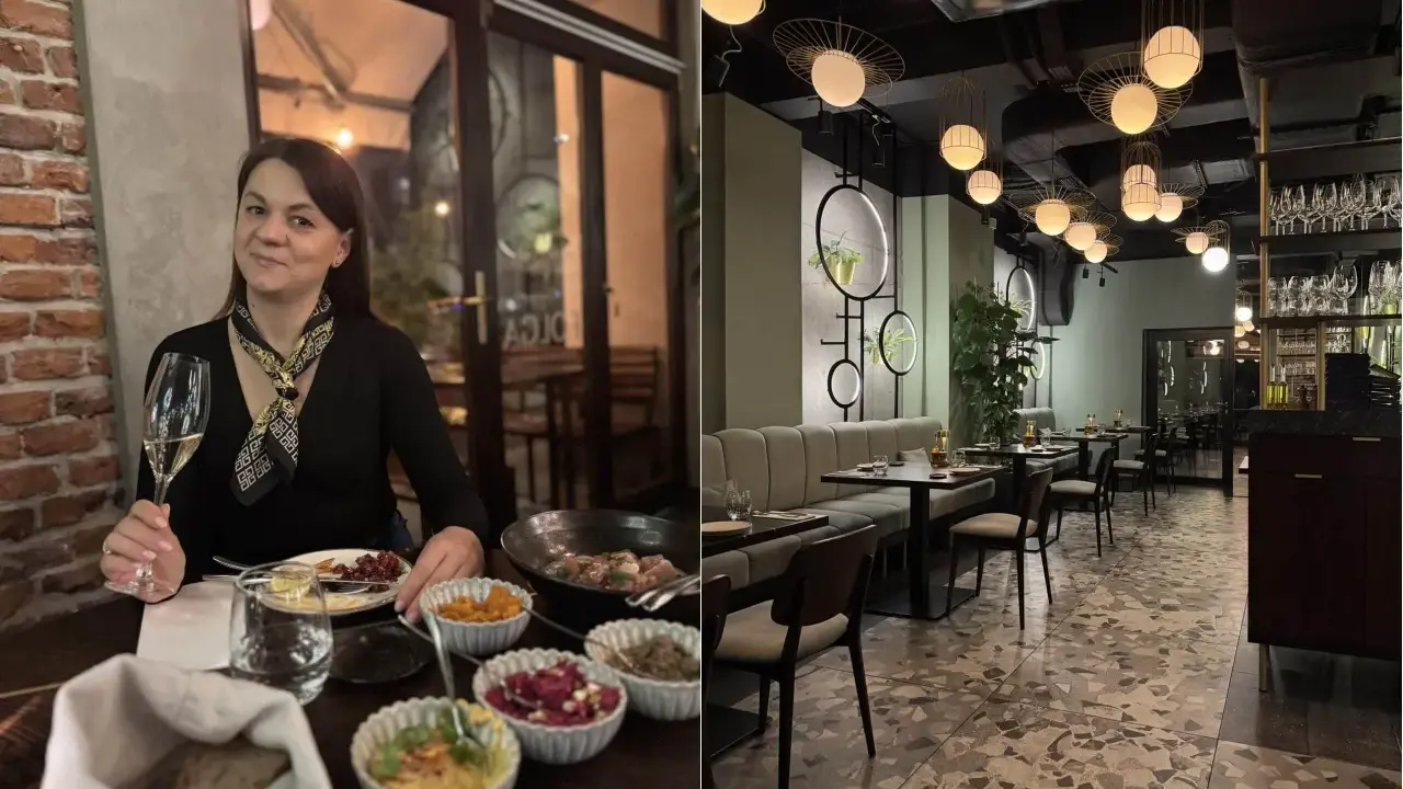 Kobieta z kieliszkiem wina w jednej z klimatycznych restauracji na krakowskim Starym Mieście. Wnętrze lokalu z nowoczesnym designem.
