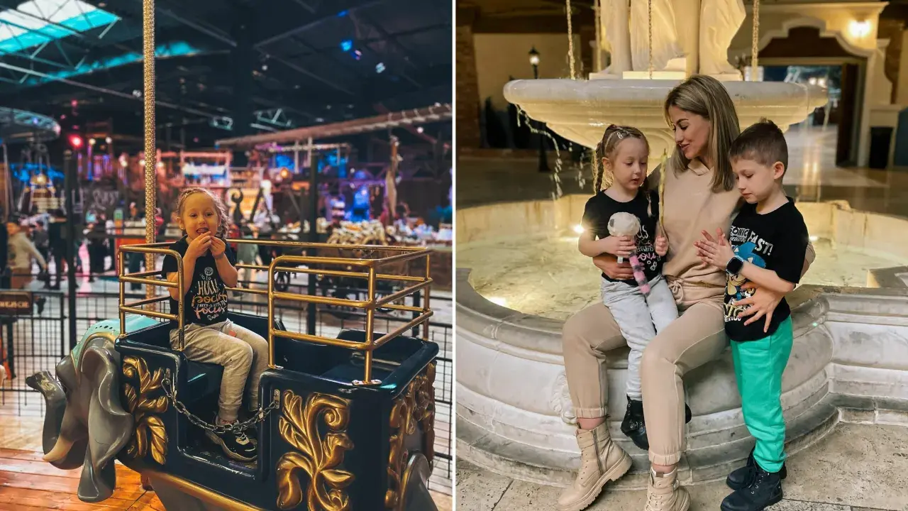 Uśmiechnięta dziewczynka w karuzeli w kształcie słonia. Obok fontanny mama z dwójką dzieci. To wspaniała łódź dla dzieci.