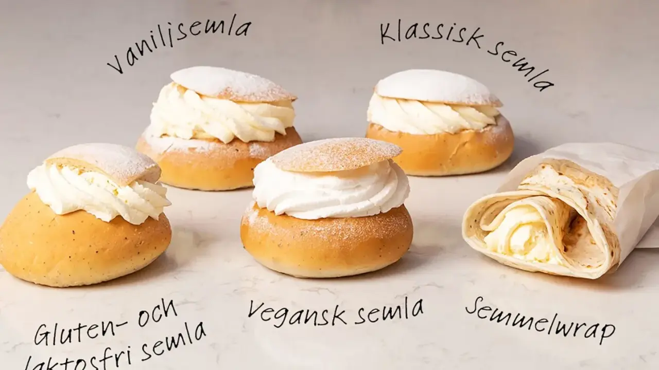 Fem olika semlor och en semmelwrap på ett marmorbord. Perfekt för semlor dagen!