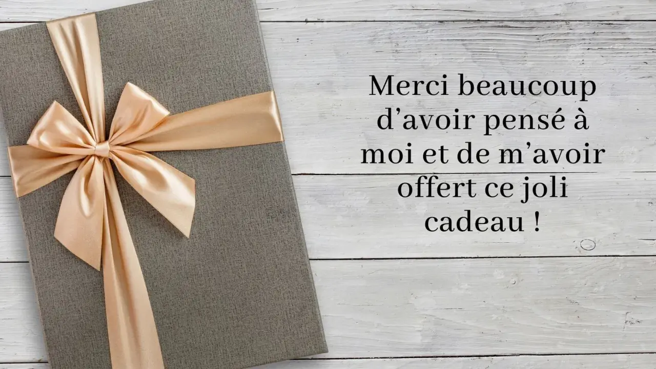 Un cadeau gris avec un ruban doré, accompagné d'un message : "Merci beaucoup d'avoir pensé à moi et de m'avoir offert ce joli cadeau !