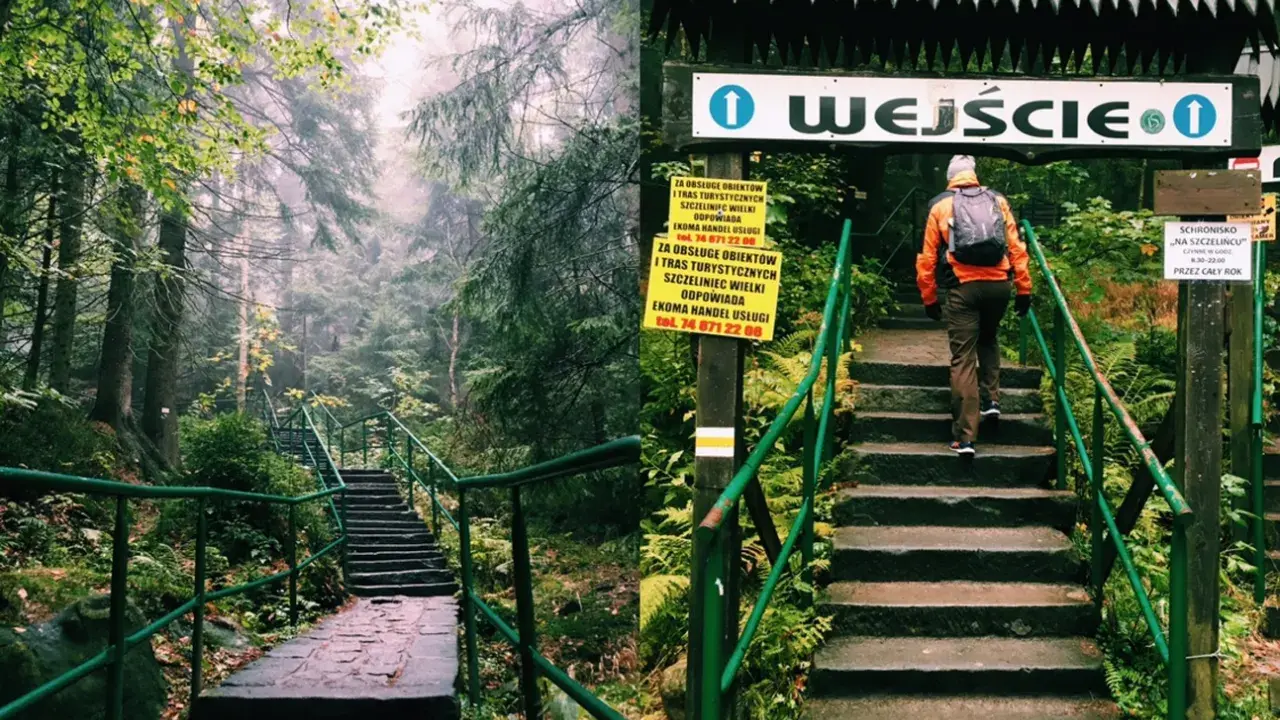 Wędrowiec wspina się po kamiennych schodach do wejścia na teren Szczelińca Wielkiego.