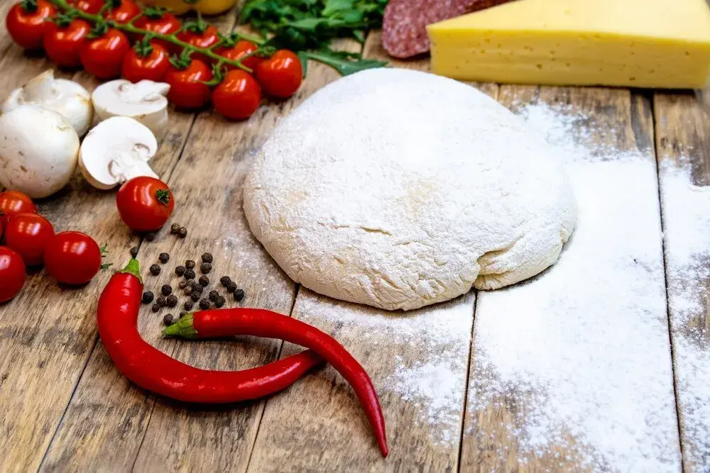 Jaka mąka do pizzy? Sekrety typu 00, W i idealnego ciasta
