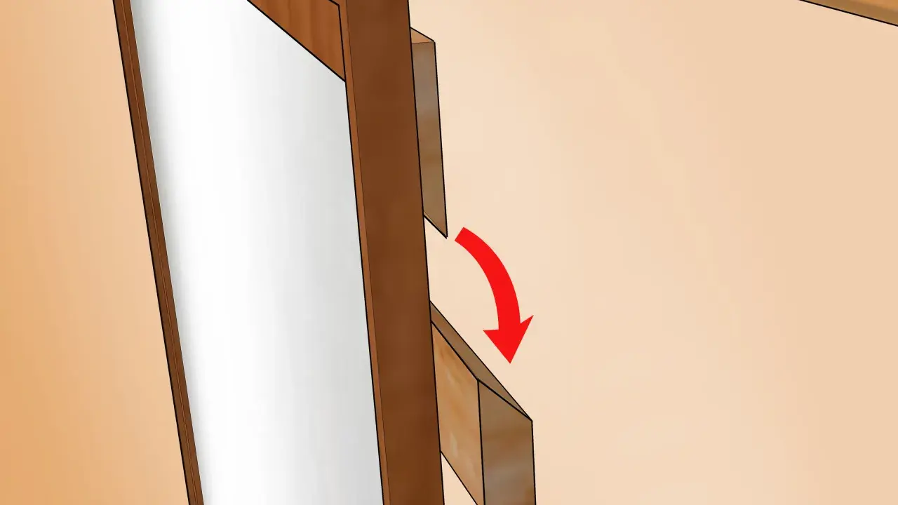 Detalle de cómo colgar un espejo. Se muestra un soporte de madera que se desliza hacia abajo para asegurar el espejo.