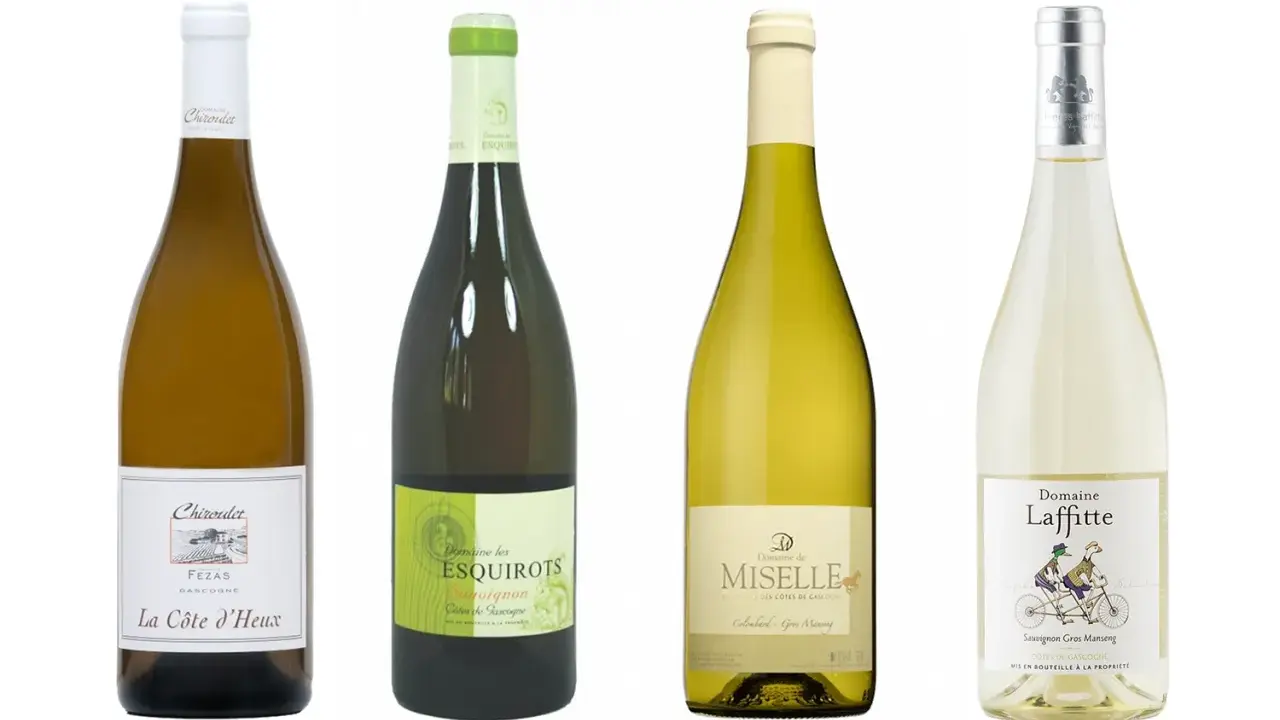 Quatre bouteilles de vins blancs : La Côte d'Heux, Domaine les Esquirots, Domaine de Miselle et Domaine Laffitte, tous des Côtes de Gascogne blanc sec ou moelleux.