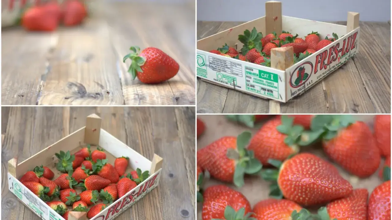 Cajas de madera con pintadas cajas de fresas decoradas, listas para ser disfrutadas. Frescura y sabor en cada detalle.