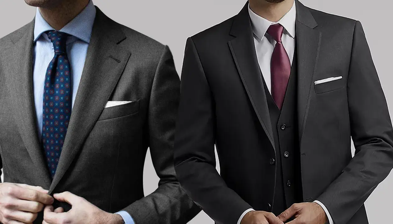 Two men showcase stylish charcoal suit combinations. One wears a patterned tie, the other a burgundy tie and vest.