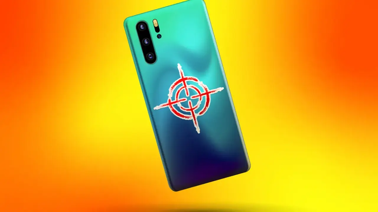 Smartphone mit Zielkreuz-Symbol auf der Rückseite. Ein Hinweis, wie man Spyware erkennen kann.