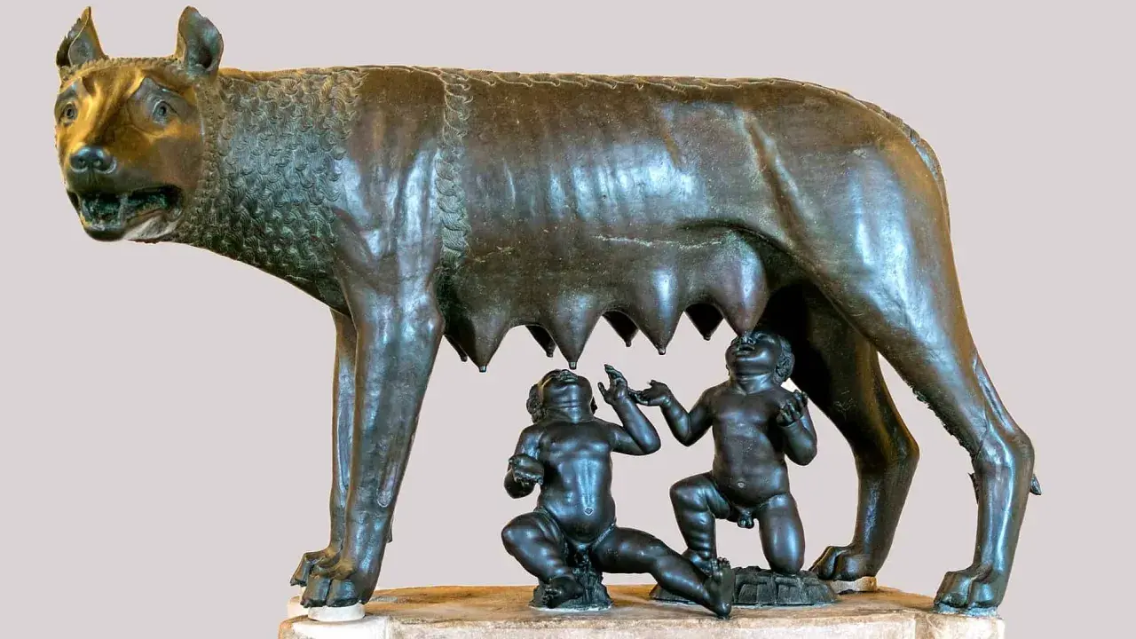 Wilczyca karmiąca Romulusa i Remusa, symboliczna scena z mitologii rzymskiej.