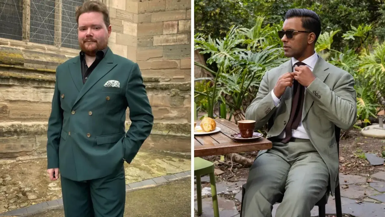 Two men in stylish suits. One wears a dark green suit with a black shirt, the other a lighter green suit with a white shirt and brown tie.