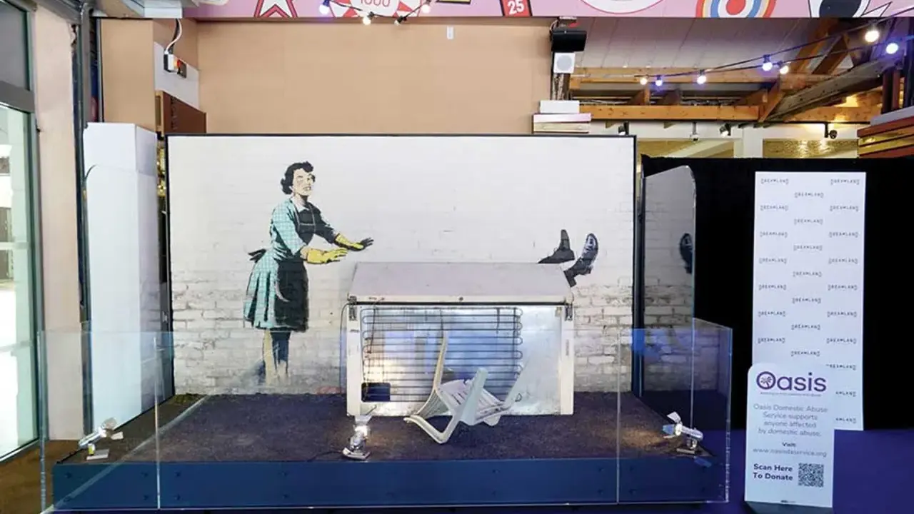 Banksy's "Girl with Balloon" installation, a prime example of art investment, displayed with a fridge and chair.
