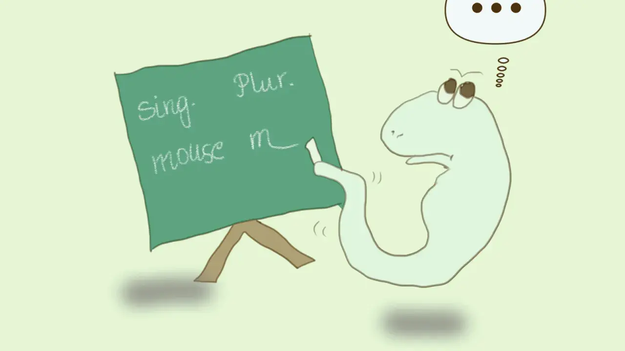 Uroczy stworek uczy się angielskiego: liczba pojedyncza i mnoga. Na tablicy "mouse" i "mice".