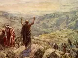 Balaam in the Bible, with arms raised, blesses Israel from a mountaintop. Another man in red looks on.