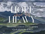 Hope when it's heavy. Trusting God is good when your season is not. A painted mountain landscape under stormy skies.