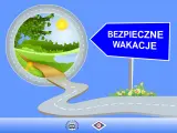 Droga prowadząca do zielonego krajobrazu pod znakiem "Bezpieczne wakacje".