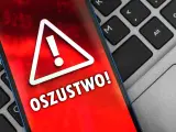Oszustwo na OLX! Czerwony ekran telefonu z wykrzyknikiem ostrzega przed oszustami. Uważaj na podejrzane oferty.