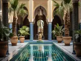 Un magnifique patio marocain avec une piscine centrale, des palmiers et des fontaines, orné de zelliges bleus et de colonnes sculptées.