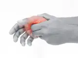 Hand mit roter Markierung am Daumenballen innen, die auf Schmerzen hindeutet.