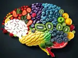 Mózg z owoców i warzyw. Kolorowe składniki tworzą kształt mózgu, sugerując, jak dieta wpływa na jego funkcjonowanie i produkcję serotoniny.