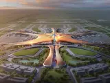 Futurystyczny terminal lotniska, przypominający rozgwiazdę, z samolotami na płycie. To największe lotnisko na świecie, z nowoczesną architekturą i otaczającą zielenią.