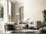 Elegancki salon z jasnymi meblami i dekoracjami. Ściany pomalowane na kremowy kolor, co podkreśla różne rodzaje tapet w subtelnych odcieniach.