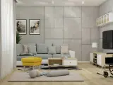 Jasny salon z szarą sofą i żółtym pufem. Jak ocieplić szary salon? Dodaj kolorowe akcenty, jak ten puf, i przytulne tekstylia.