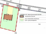 Fragment planu zagospodarowania przestrzennego: projektowany budynek, nawierzchnie utwardzone i powierzchnia biologicznie czynna.