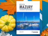 Przewodnik "Ruszaj na Mazury" z widokiem na żaglówki i miasteczko. Idealny na podróż po krainie tysiąca jezior.