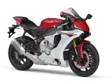 Sportowy motocykl Yamaha R1 2016 w kolorze czerwono-białym, gotowy do jazdy.