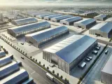 Vista aérea de un polígono industrial con naves de fachada zinc.