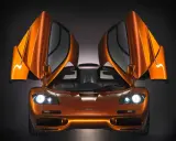 Orange McLaren F1 mit geöffneten Flügeltüren. Ein Traumauto, dessen McLaren F1 Preis unbezahlbar ist.