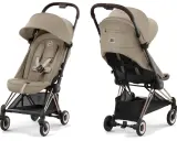 Elegancki wózek spacerowy Cybex w kolorze beżowym, z brązową rączką i złotymi elementami. Idealny na spacery.