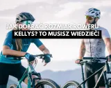 Para dobrać idealny **kelly's rozmiar ramy**, potrzebujesz wiedzy! Dwie osoby w kaskach i okularach rowerowych stoją obok swoich rowerów.