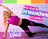 Kobieta wykonuje ćwiczenia na macie, boczną deskę. Trening "Dywanówka 40 minut" dla pięknego ciała.
