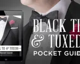 A tablet displays a guide to black tie attire for men, featuring a tuxedo with a bow tie and boutonnière.
