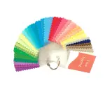 A fan of fabric swatches in various bright colors, with a tag reading "True Spring".