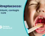 Bambino con gola arrossata e tonsille infiammate, possibile segno di stafilococco. Sintomi, contagio e cure.