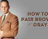 Man in a brown suit with a patterned tie and pocket square, demonstrating how grey and brown match.