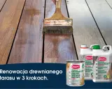 Renowacja drewnianego tarasu z Owatrol. Pędzel nakłada olej na deski, przywracając im blask.