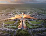 Futurystyczny terminal lotniczy, przypominający rozgwiazdę, z licznymi samolotami na płycie. To wizja największego lotniska na świecie.