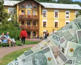 Czy sanatorium poszpitalne jest płatne? Na zdjęciu widać żółty budynek sanatorium i ludzi, a także stos polskich banknotów.