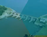 Staudamm mit mehreren Toren, der die **hydraulische Energie** nutzt, um Strom zu erzeugen.